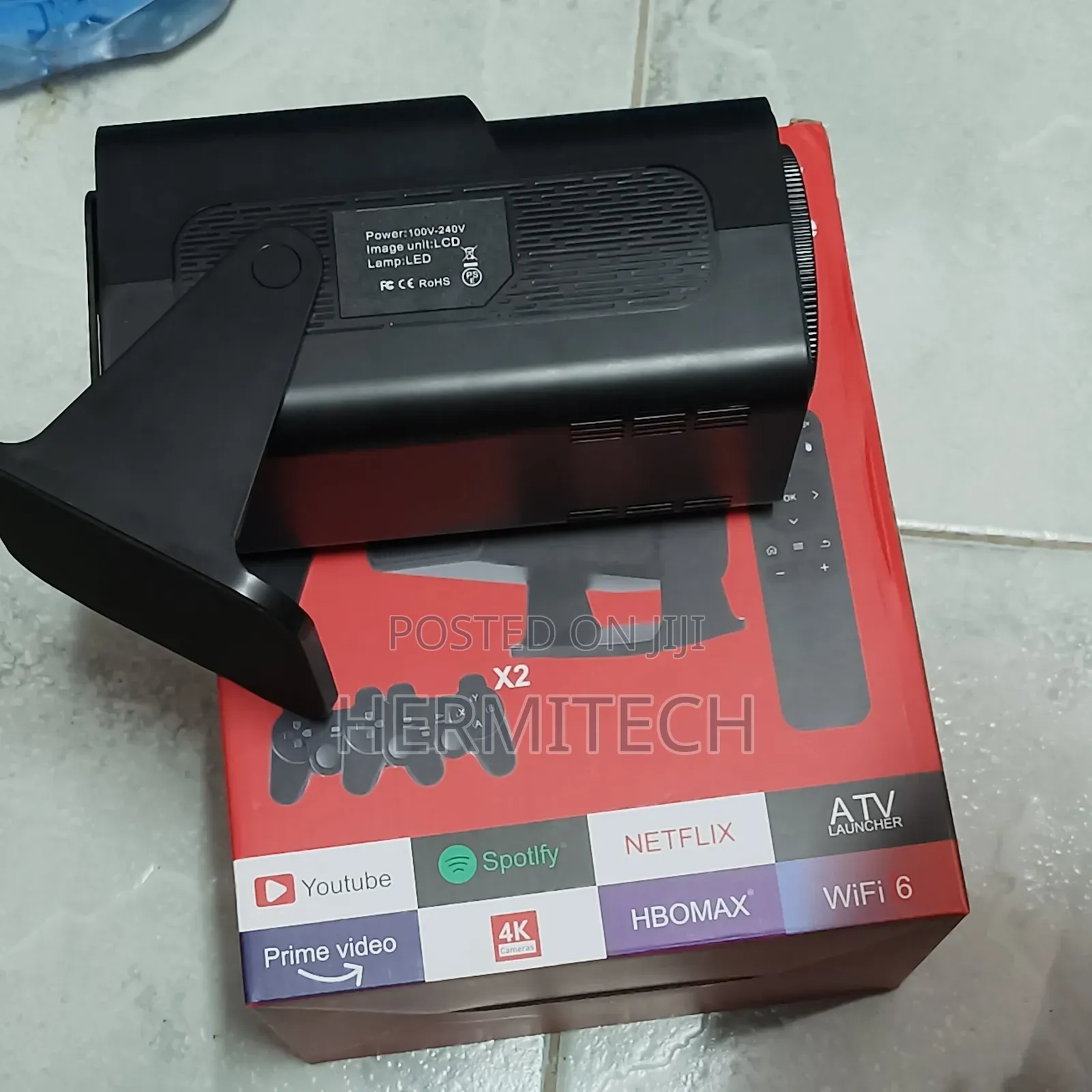 Gaming Projector With Downloaded Games and Two Gaming Consoles
