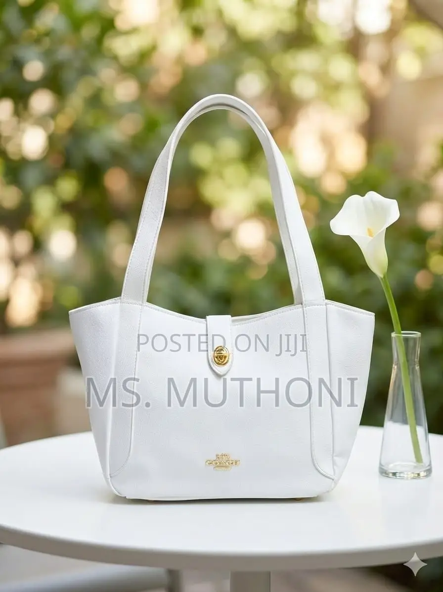 Coach Hadley Turnlock Tote Bag in Signature Canvas and Smooth Leather