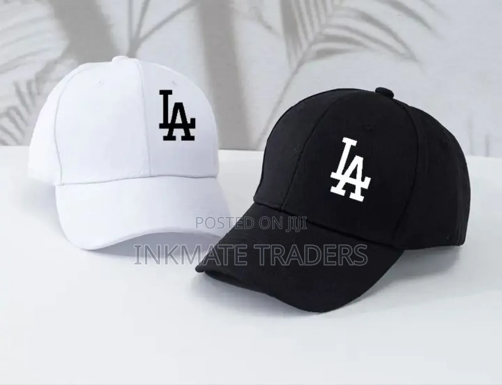 La White and Black Caps Available