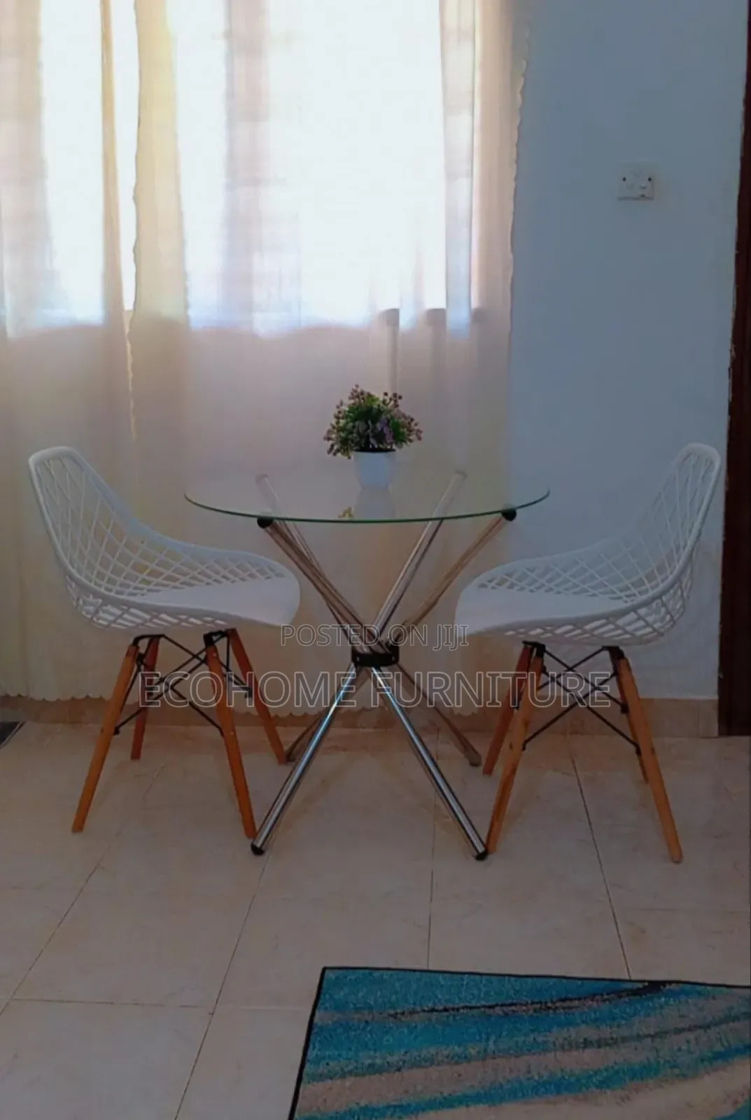Round Table and Mesh Eames Chairs