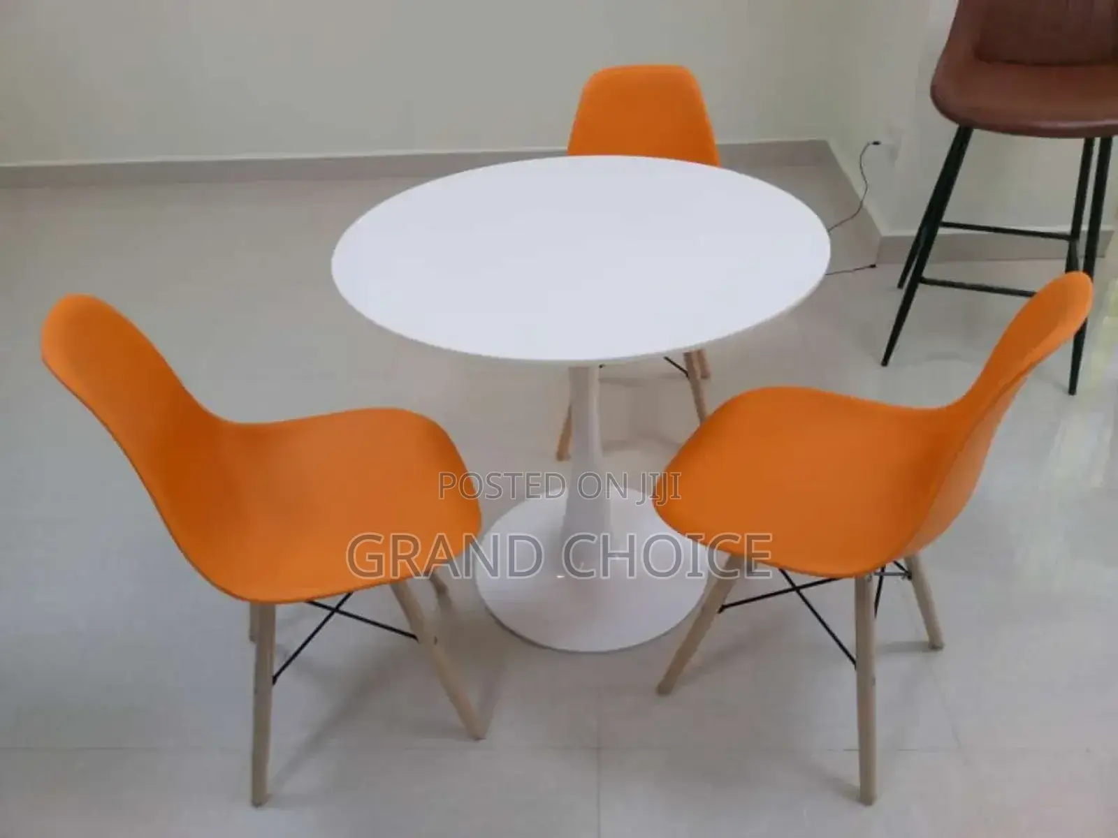 Round Dining Table With Eames Chairs-White^Orange