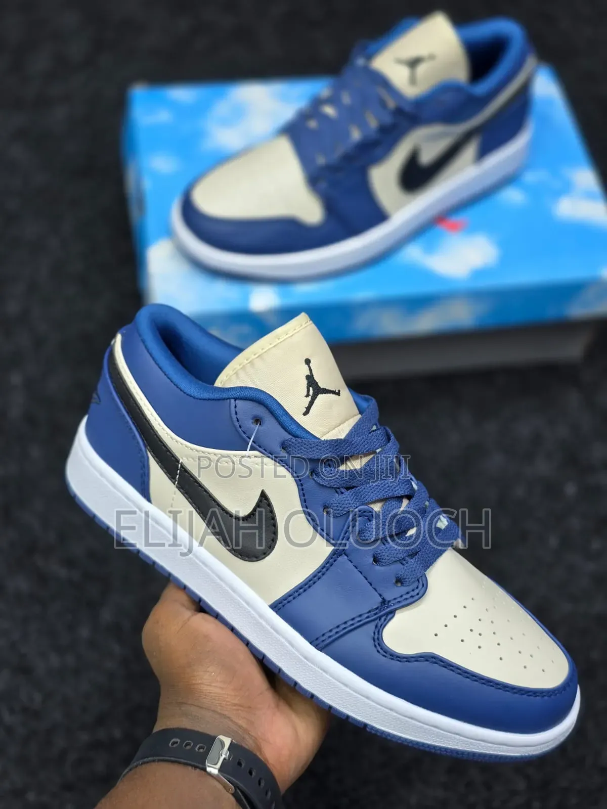 Nike Air Jordan 1 Low in a French Blue and College Grey Colorway.