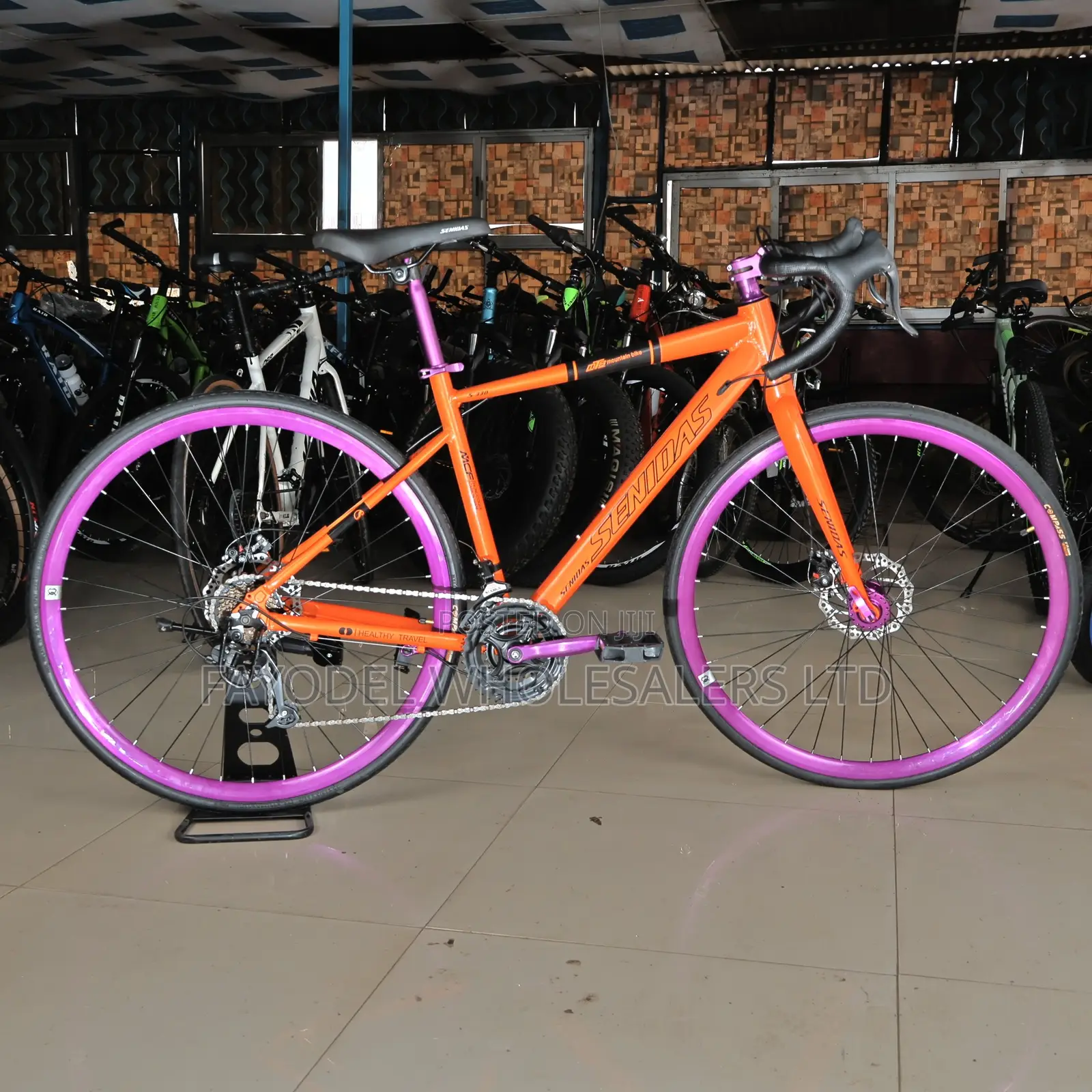 Ride Fast in Style – Senidas 26” Orange Road Bike