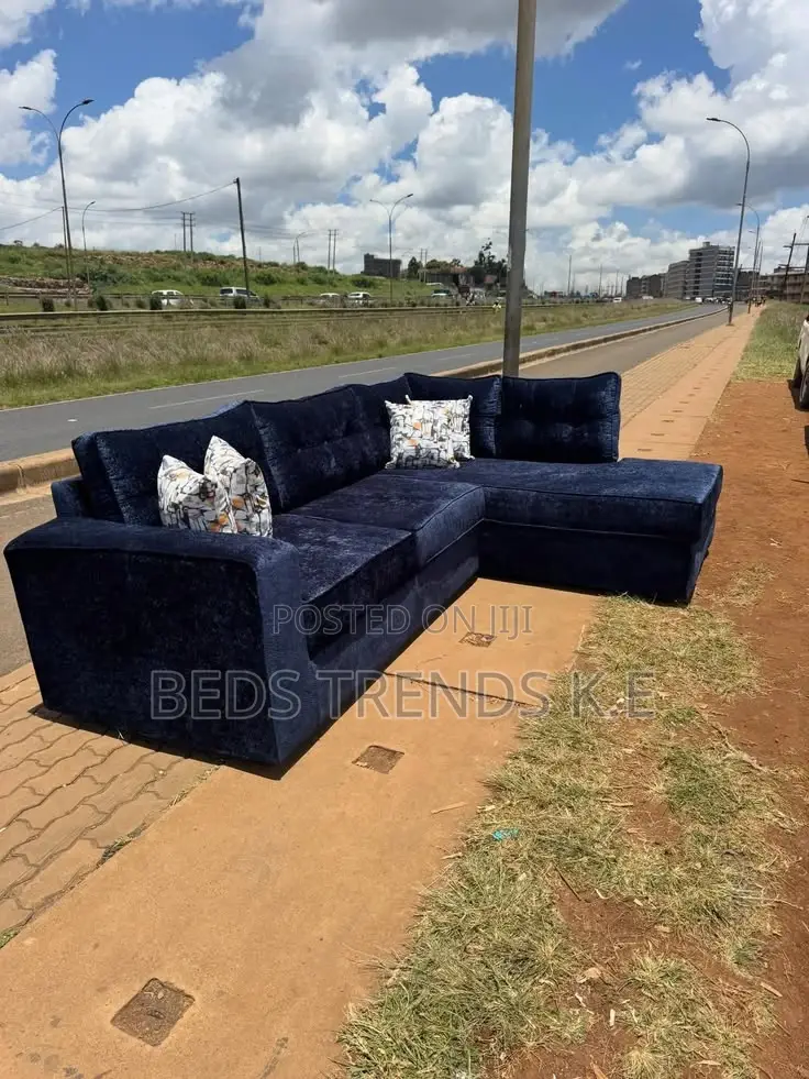 Dark Blue L-Shaped Sectional Sofa With Cushions and Chaise
