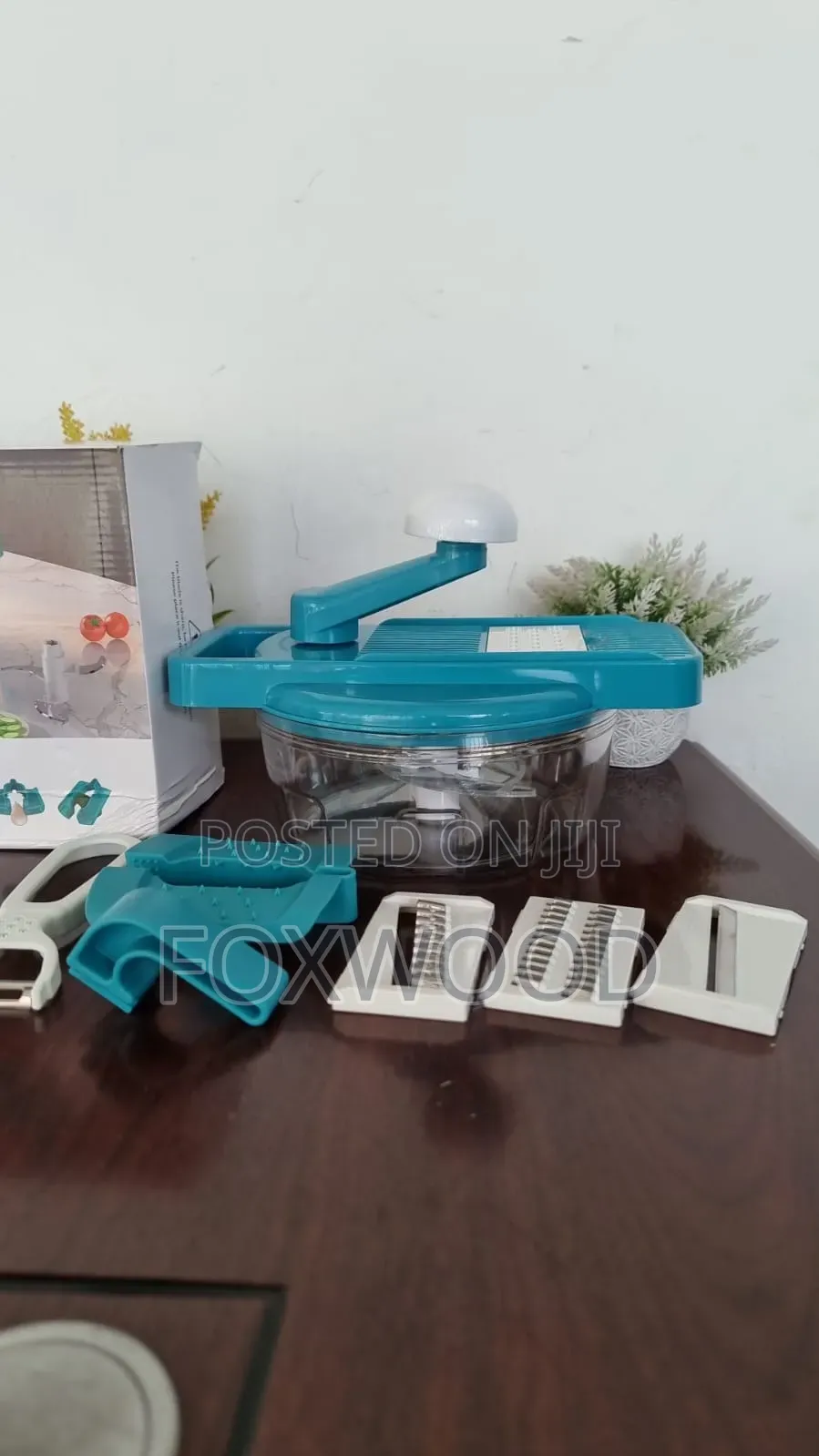 2-in-1 Manual Food Processor, Chopper, and Grater With a Peeler.