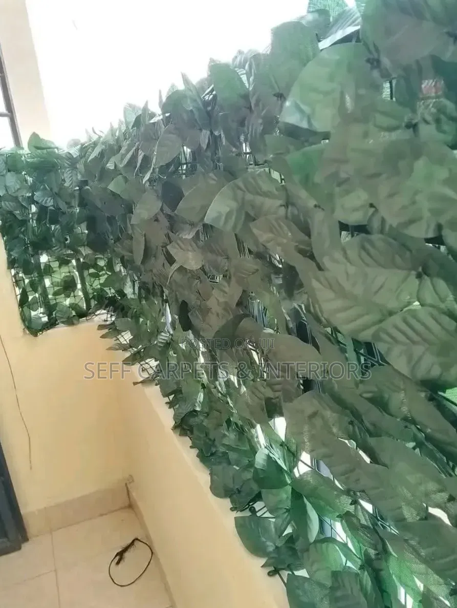 Green Flowered Balcony Fence and Grass Carpets