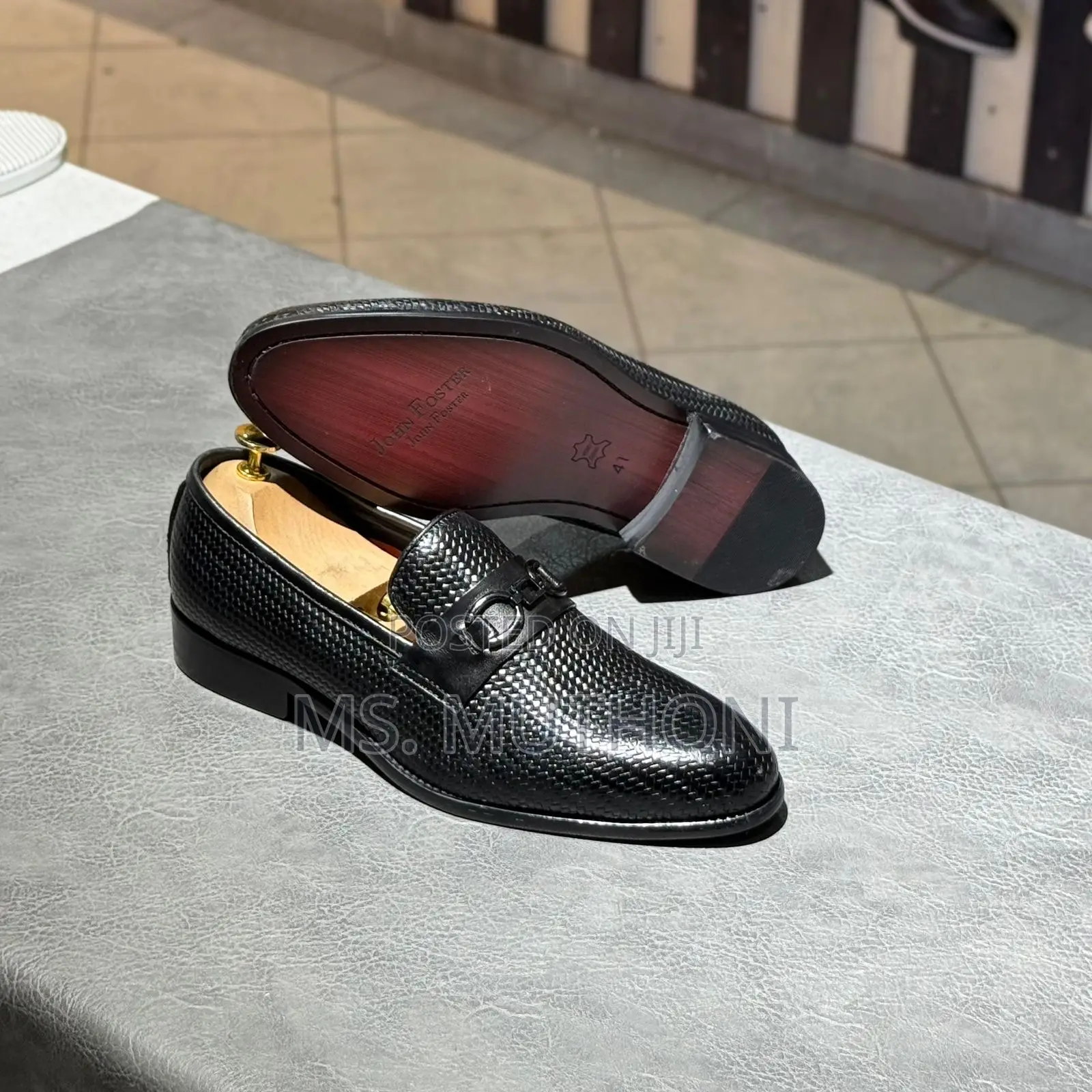John Foster Black Textured Leather Loafers With a Horsebit Detail.