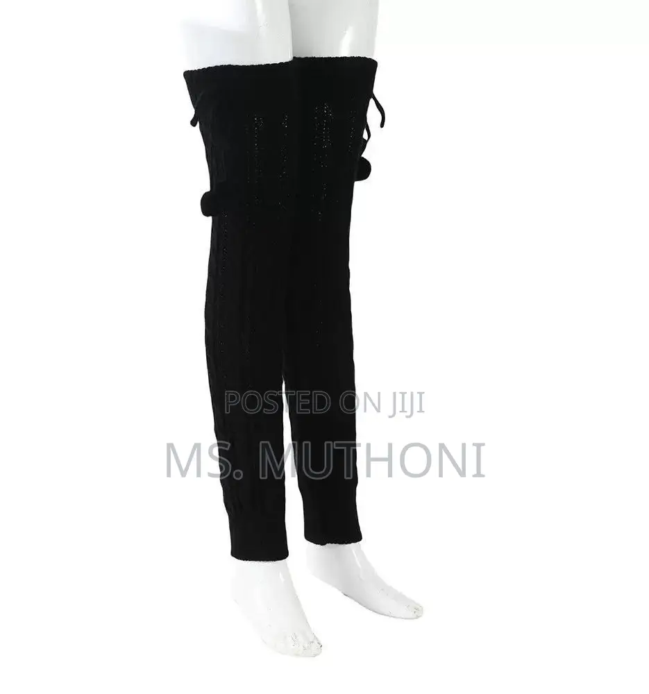 Cable-Knit Leg Warmers Featuring Decorative Pom-Poms and Ribbed Cuffs