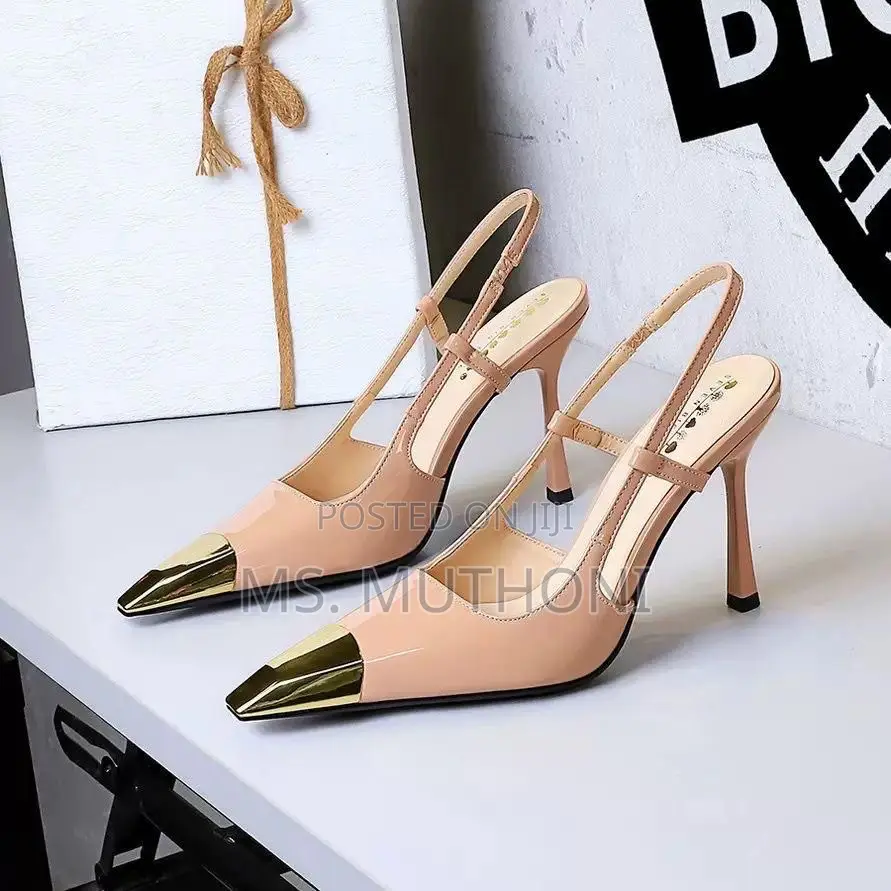 Slingback Heels Featuring a Pointed Toe With a Gold Metal Cap Pumps