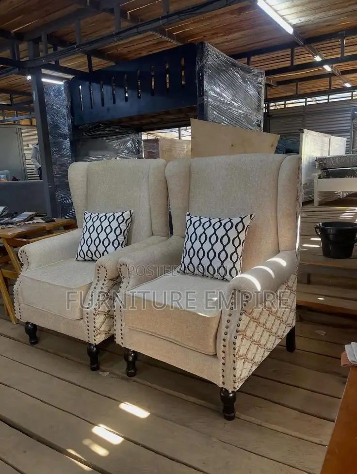 Elegant Beige Armchairs With Patterned Cushions