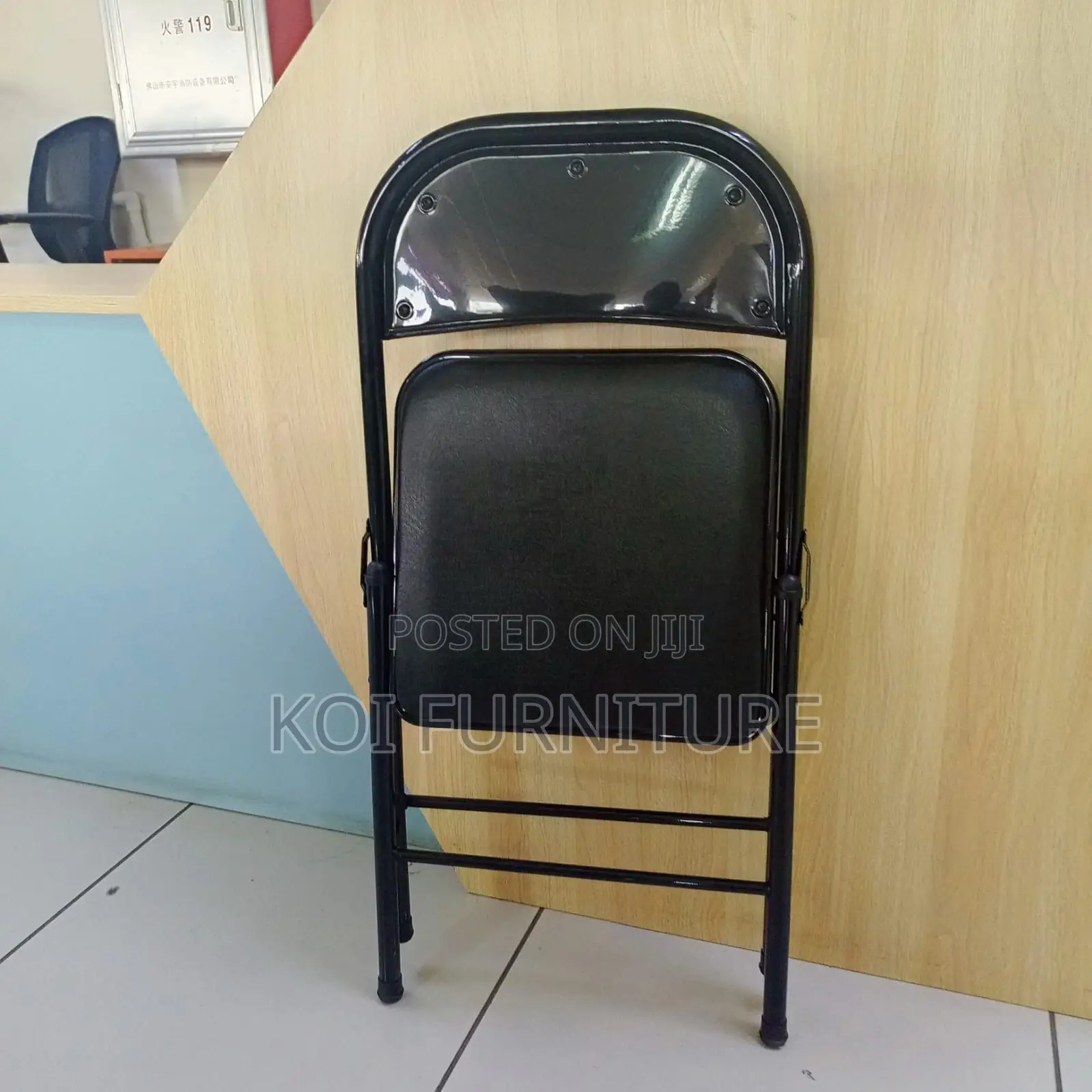 Office Chair : Padded Black Leather Foldable Chair With a Steel Frame