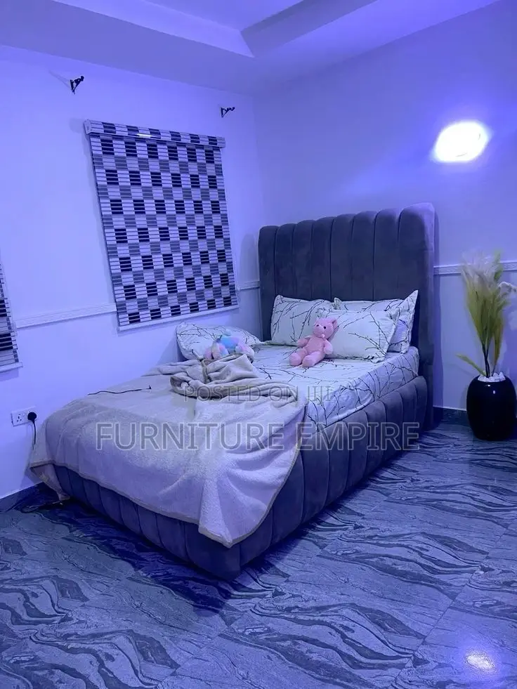 Stylish Dark Grey Upholstered Bed With Curved Headboard