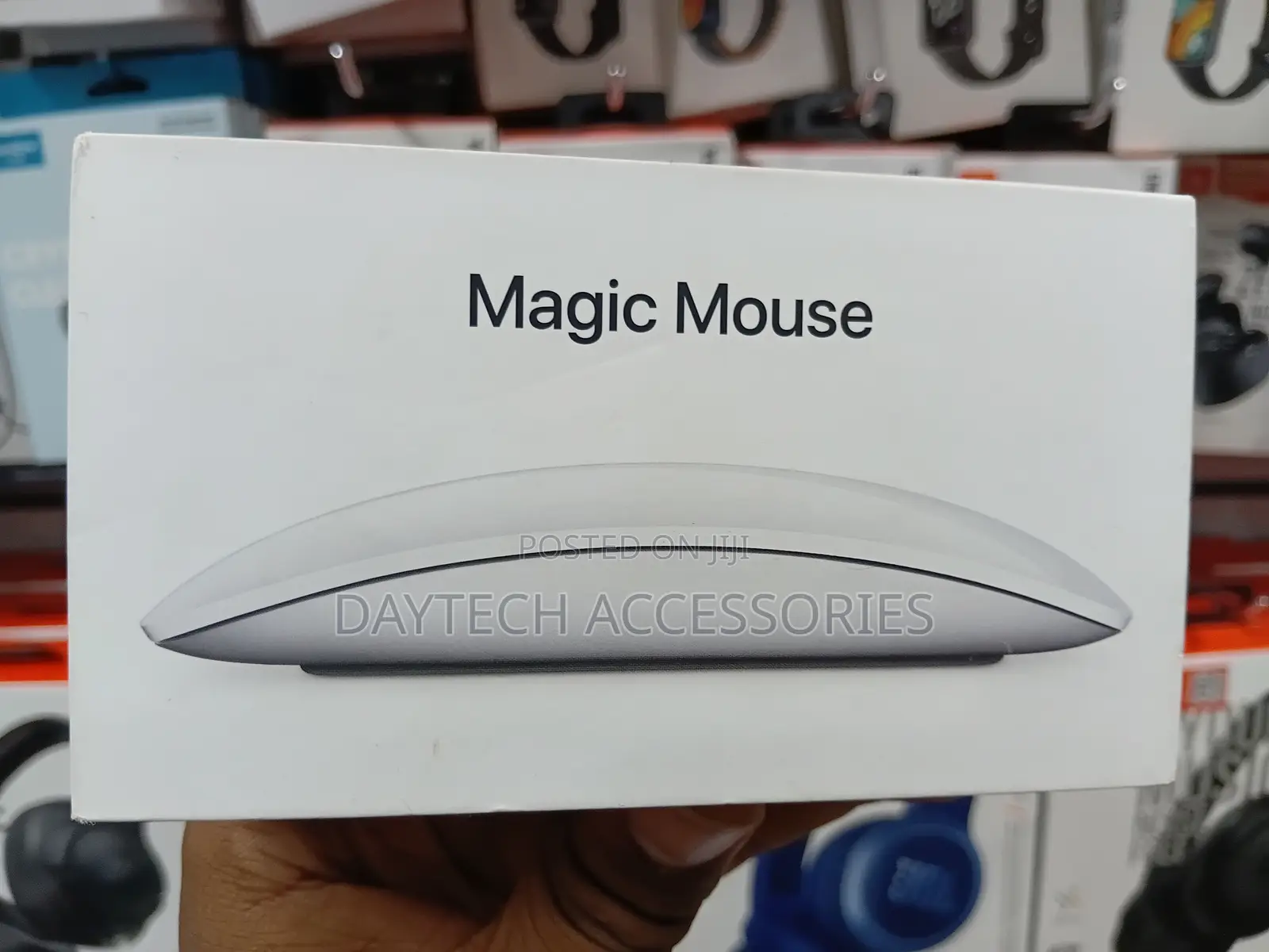 This Is an Apple Magic Mouse in White With a Multi-Touch Surface.