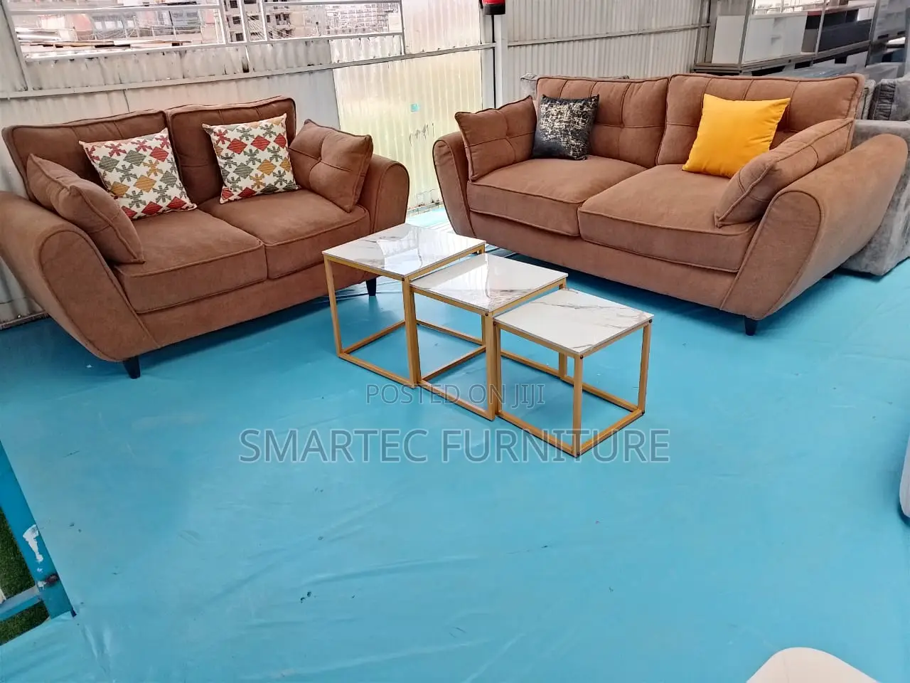 5 Seater Pair of Brown Butterfly Sofas.