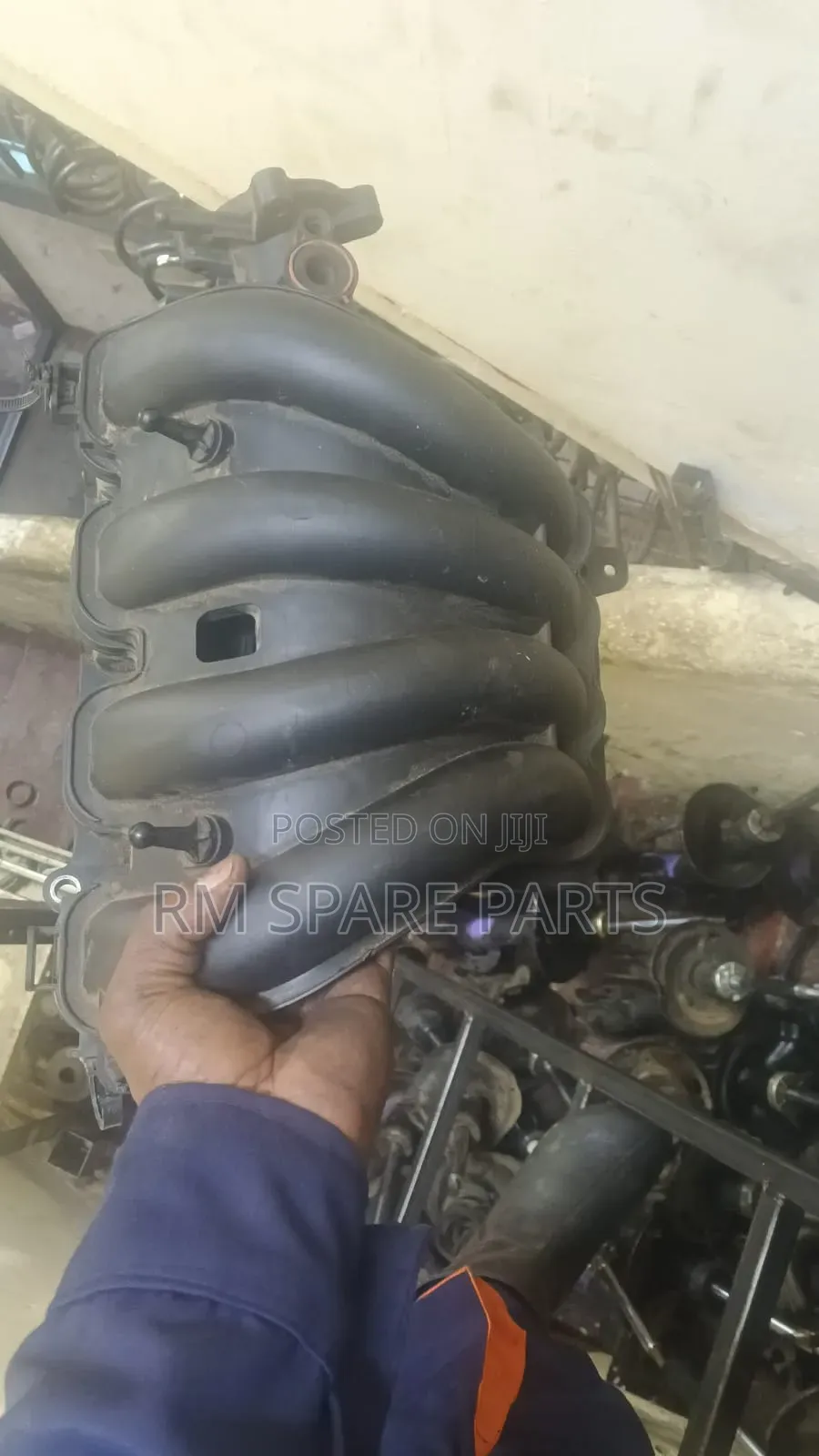 Manifold Mazda Demio