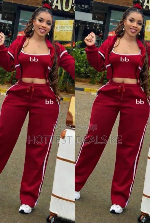 Three-Piece Tracksuit Set Features a Branded Crop Top and Jacket