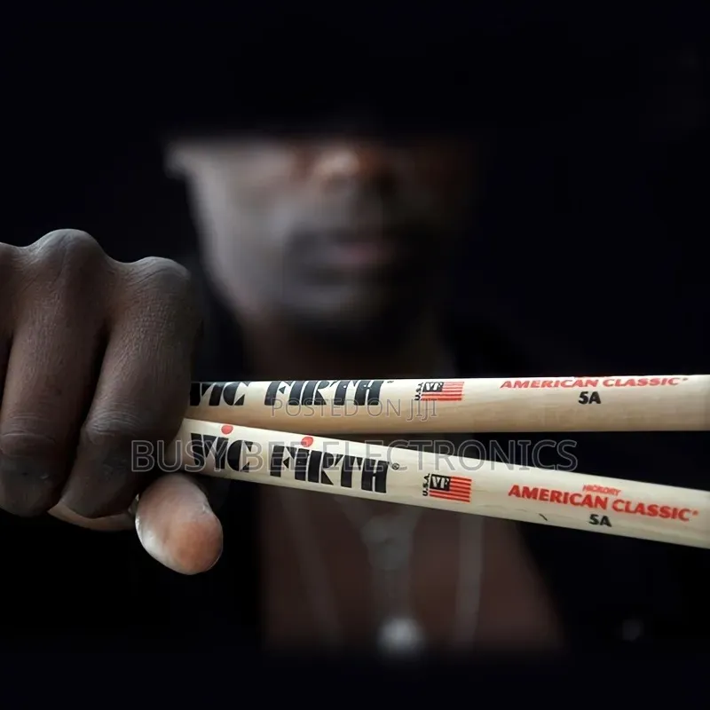A Set of 2 5a Walnut Drumsticks, Perfect for Jazz Drummers.