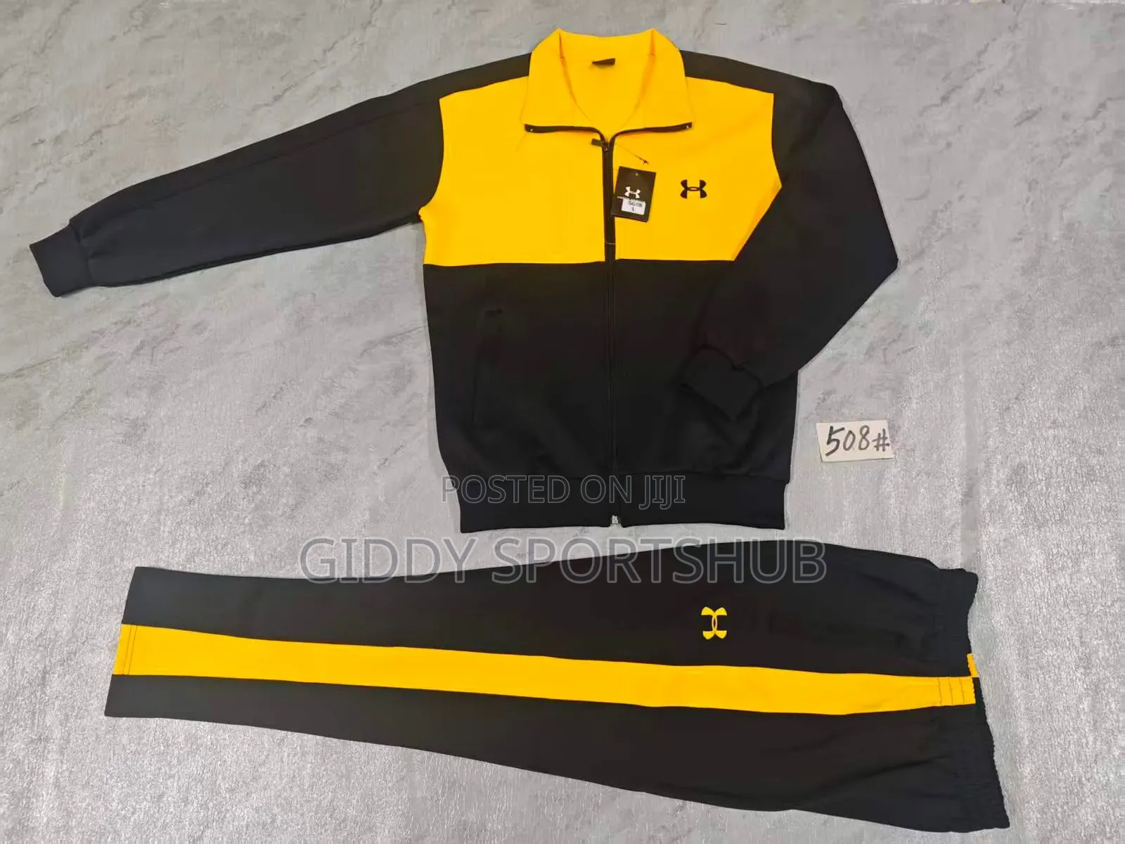 Under Armour Model 1175 Tracksuit Featuring Black and Yellow