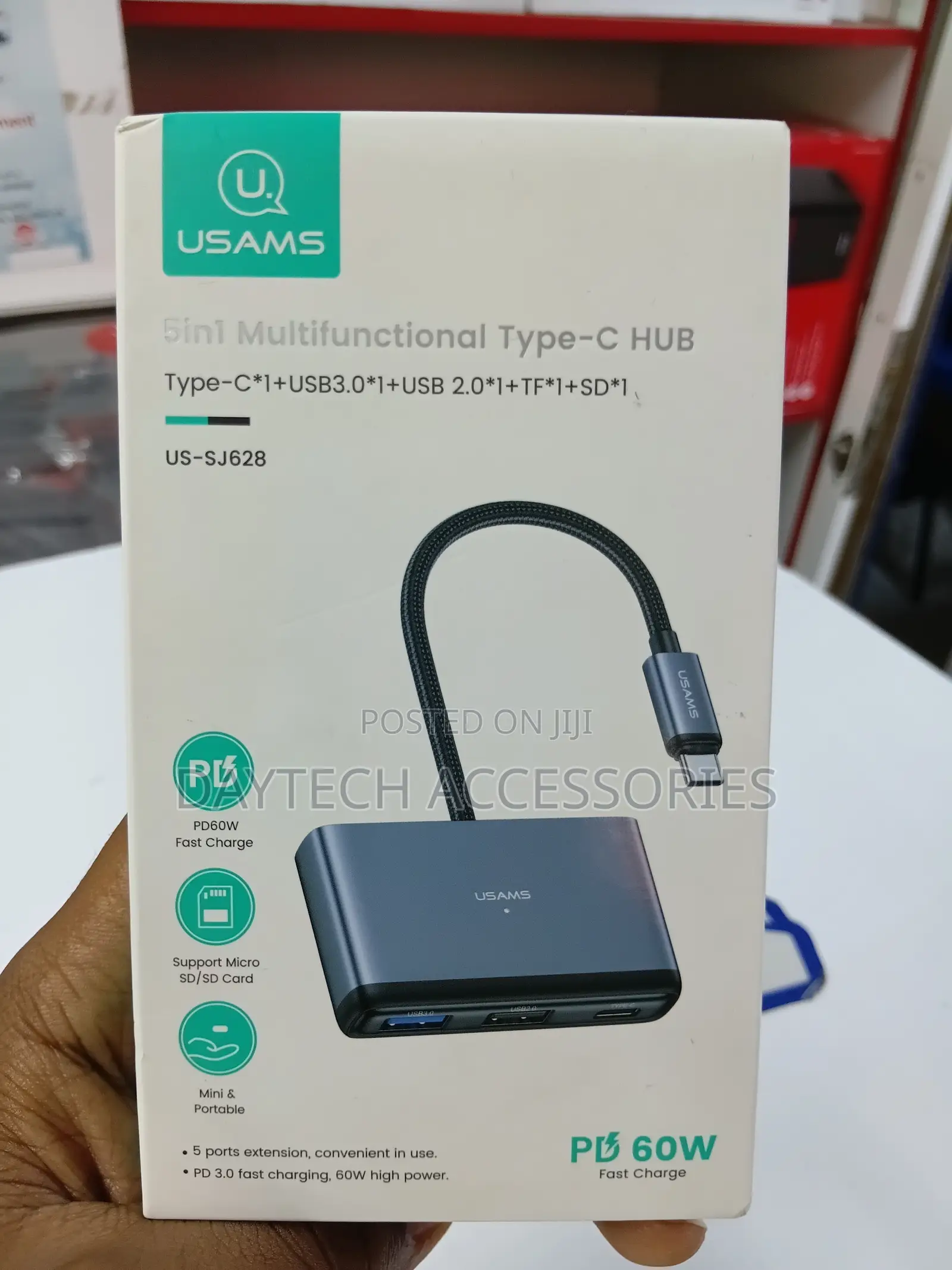 This Is a Usams Us-Sj628 5-in-1 Multifunctional Type-C Hub in a Gray.