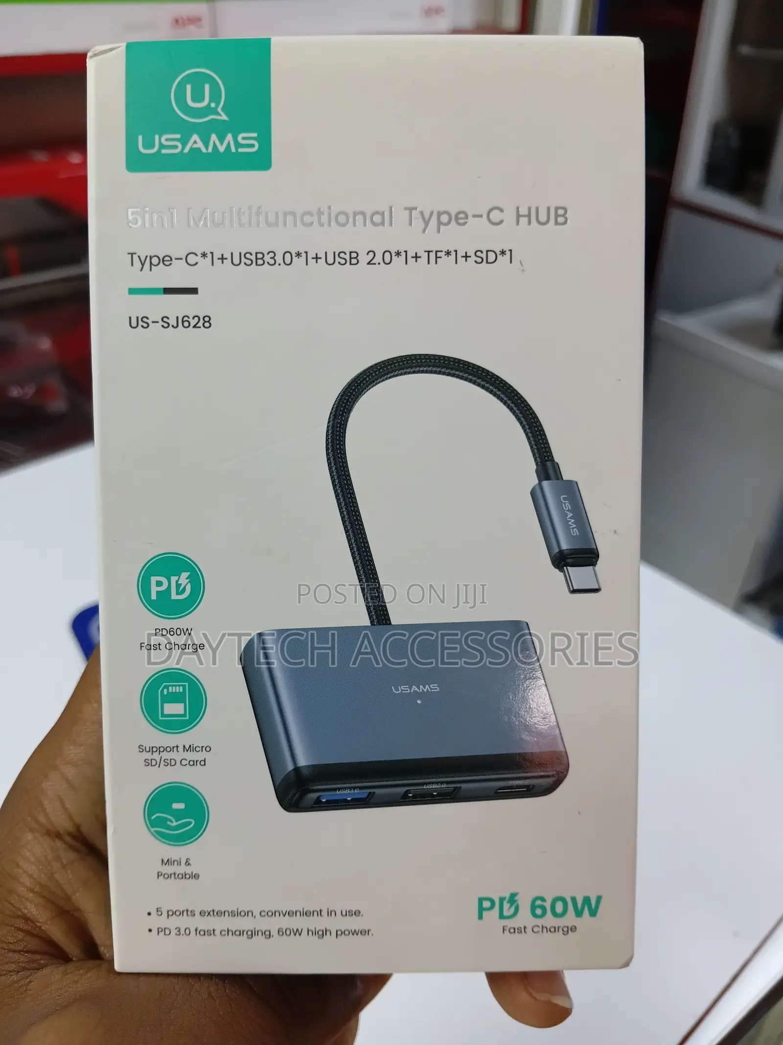 This Is a Usams Us-Sj628 5-in-1 Multifunctional Type-C Hub in a Gray.