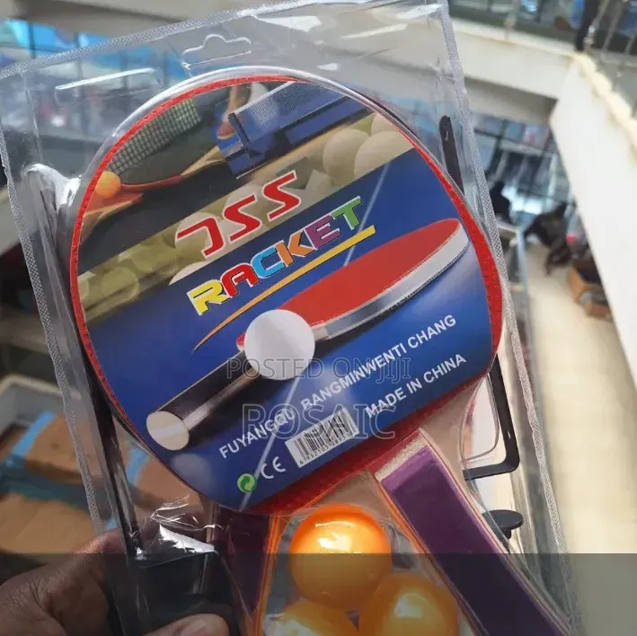 Two Rackets and Three Orange Balls in a Blister Pack