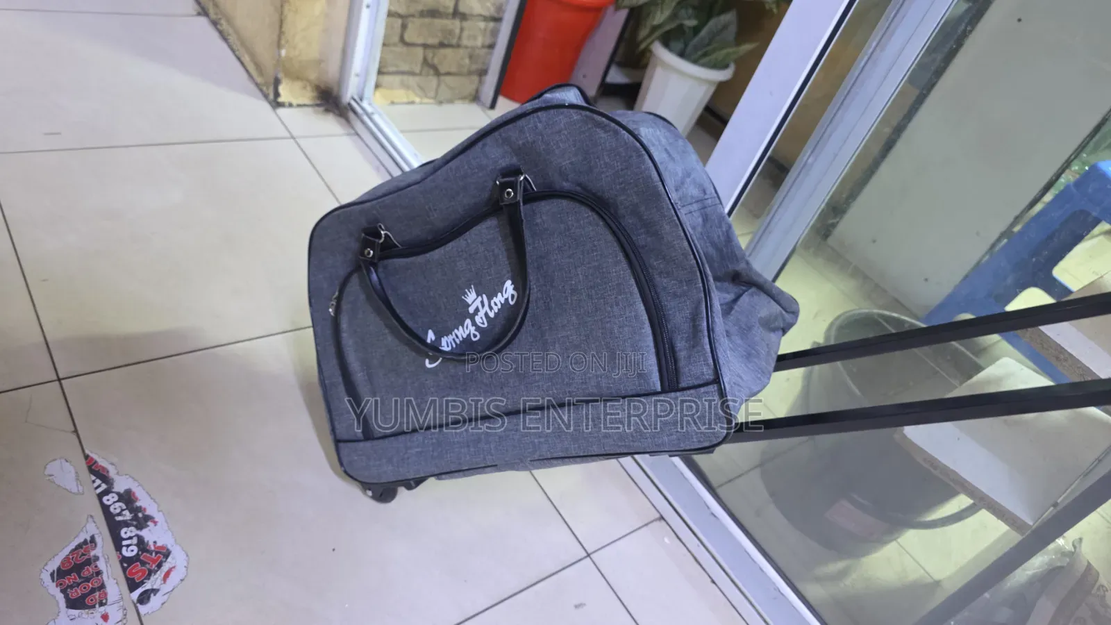 Grey Travelling Bag on Wheels With Wheels