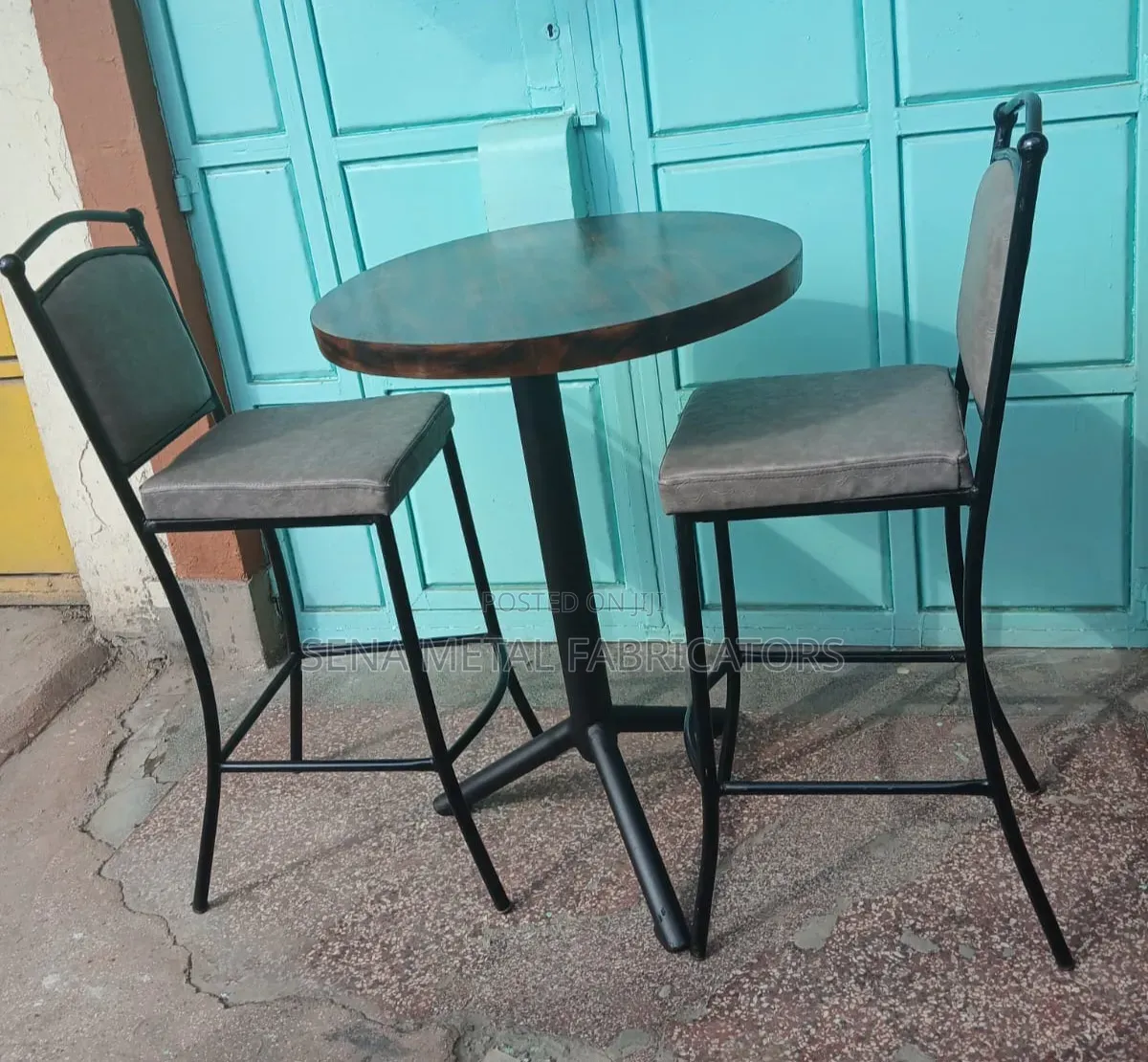 Bar Table Set With a Patterned Wooden Top.