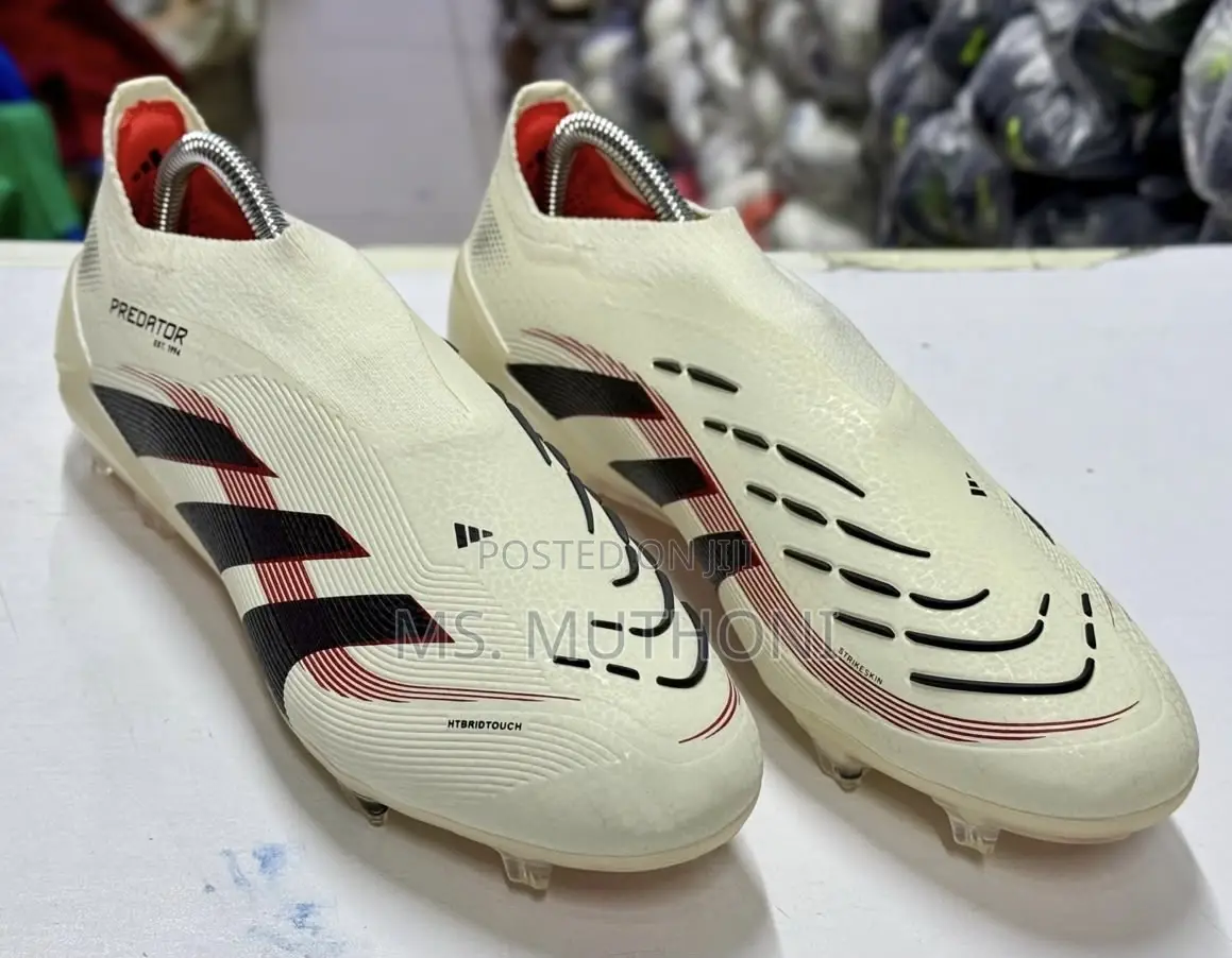 The Adidas Predator Elite Laceless FG Ruby Football Shoes