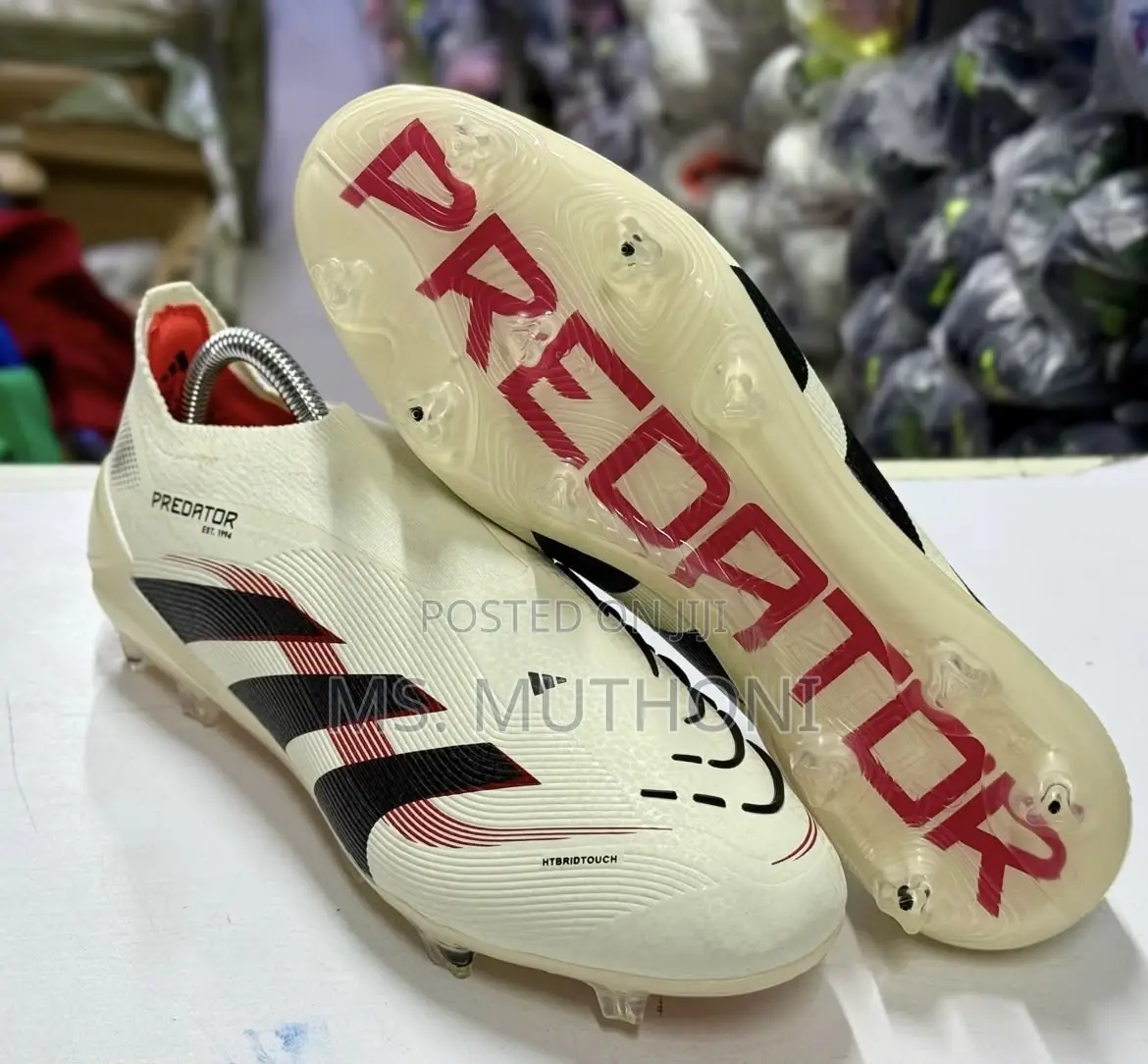 The Adidas Predator Elite Laceless FG Ruby Football Shoes