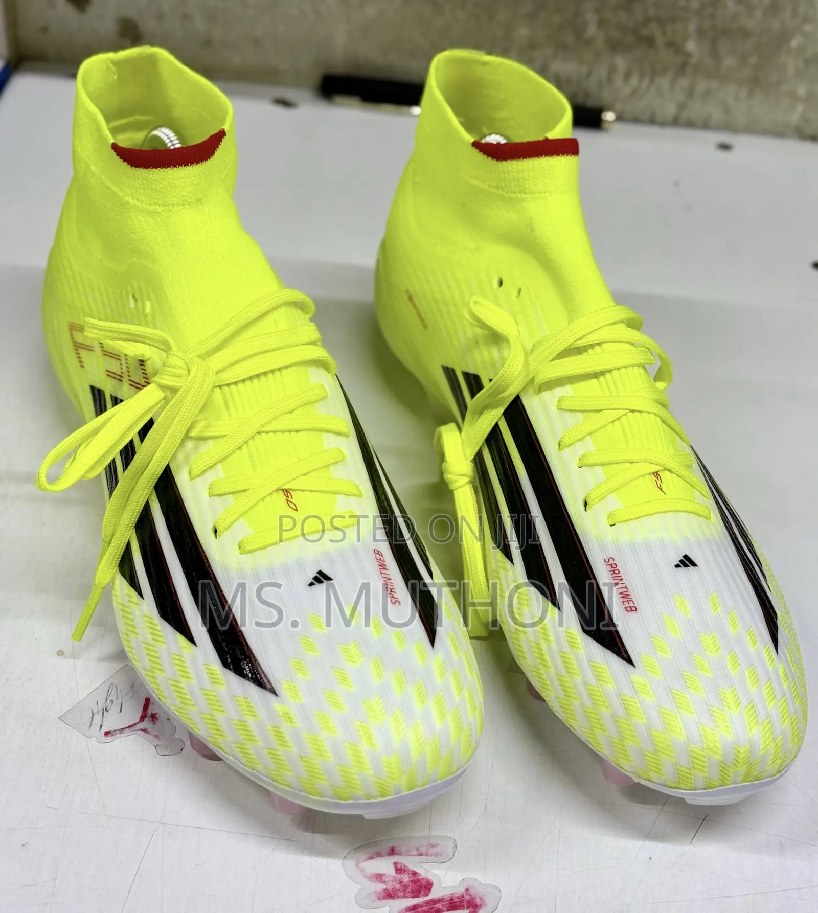 The Adidas F50 League Mid Firm Ground/Multi-Ground Soccer Cleats 40-45
