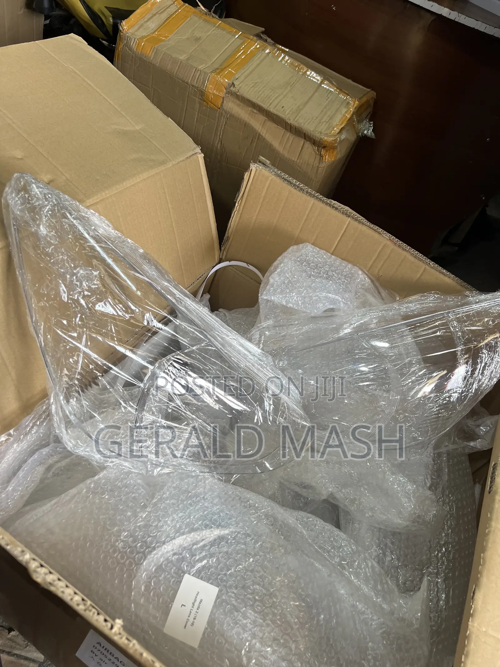 Lens Mazda Demio