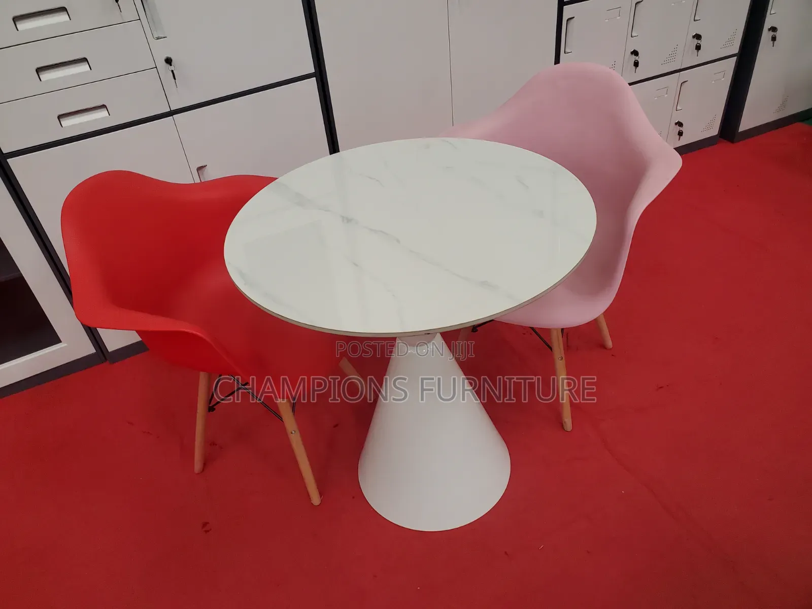 Round Trumpet Base Table and Eames Armchairs