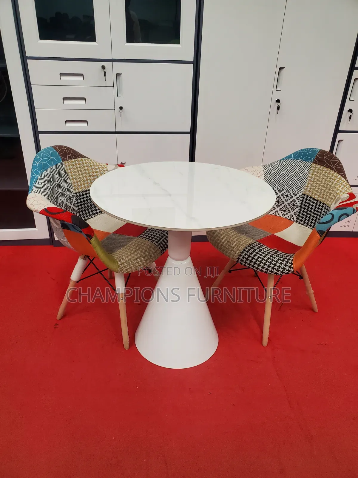 Round Trumpet Base Table and Patchwork Eames ArmChairs