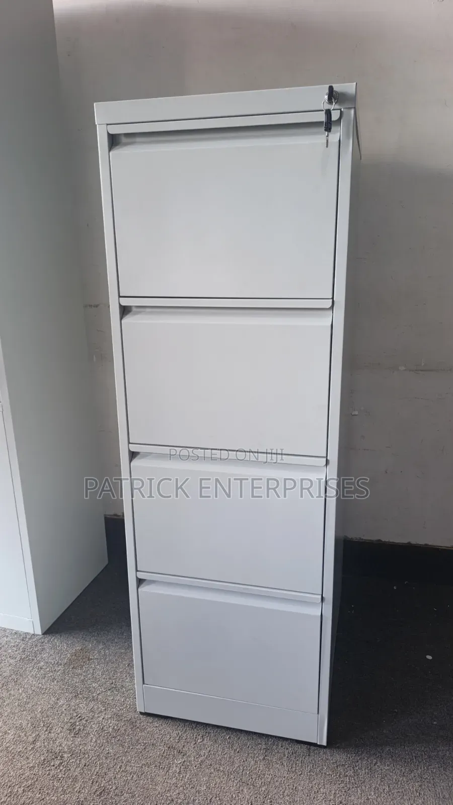 This Grey 4-Drawer Metal Office Filing Cabinet , Locking Mechanism.