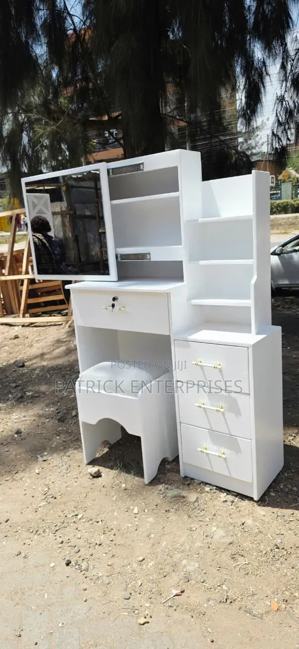 Modern White Dressing Table With a Sliding Mirror With Storage Shelves