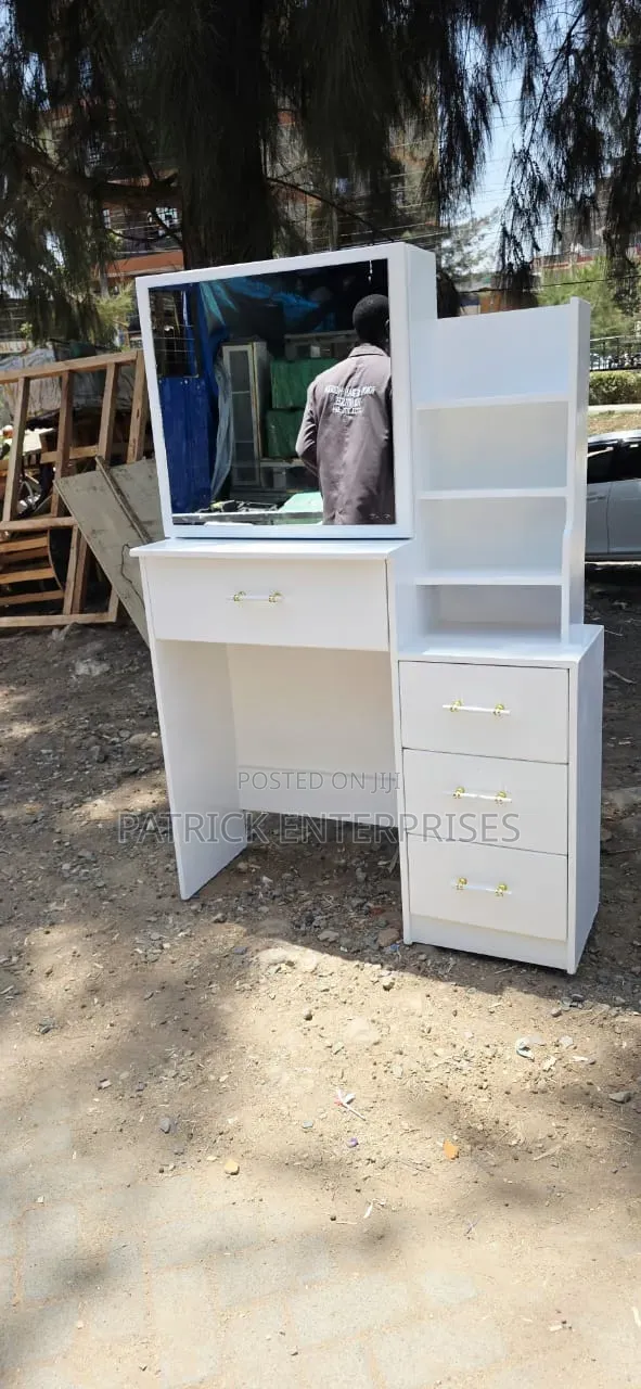 Modern White Dressing Table With a Sliding Mirror With Storage Shelves