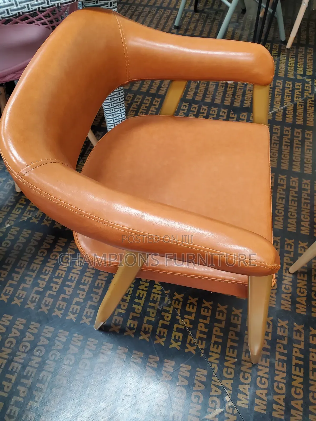 Curved Cognac Leather Accent Chair