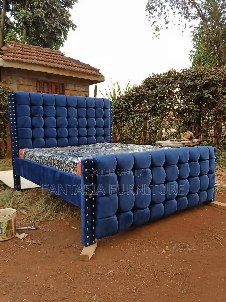 Blue Tufted 5 by 6 Bed