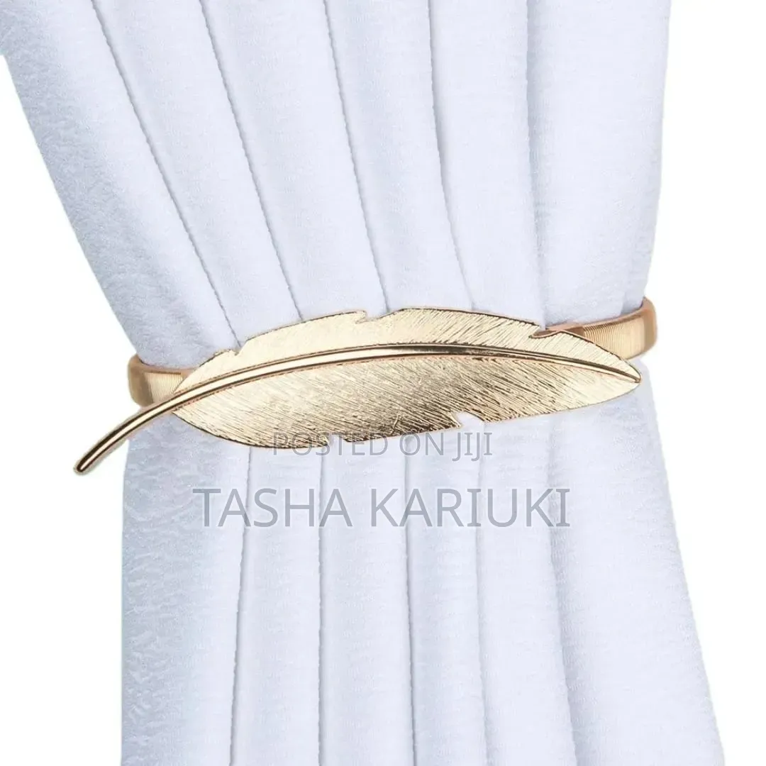 A Pair of Feather Shaped Elastic, Metallic Curtain Buckles @Gale