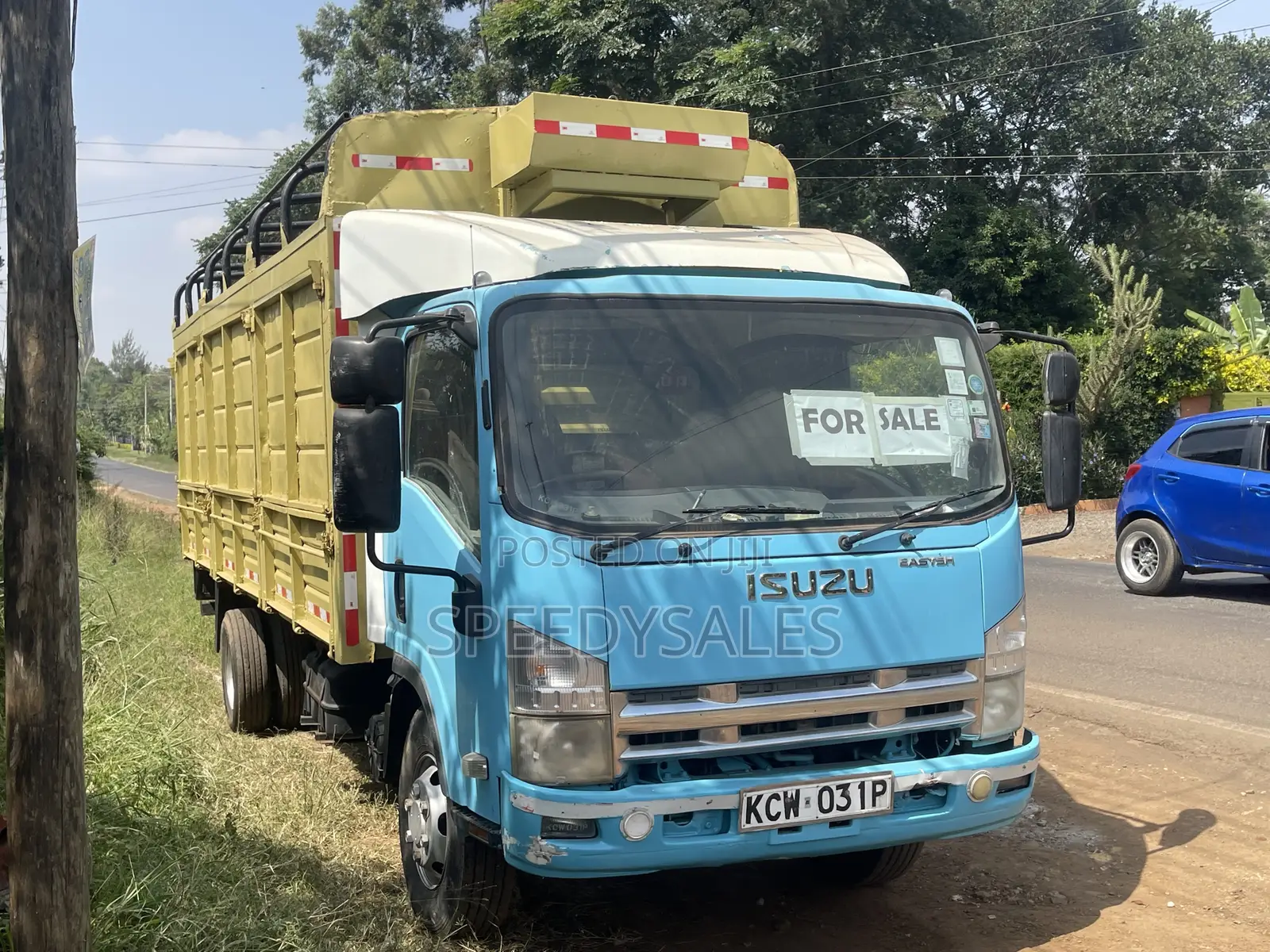 Isuzu NKR 75 Cargo Truck