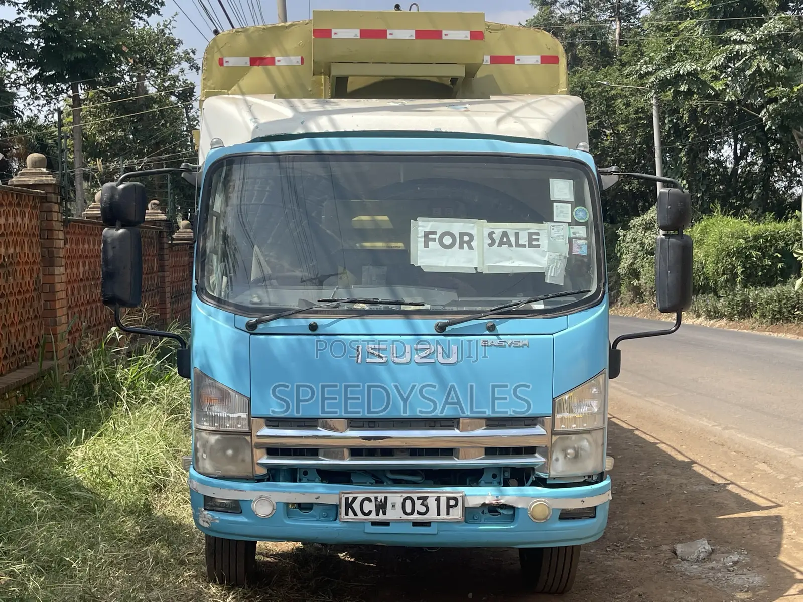 Isuzu NKR 75 Cargo Truck