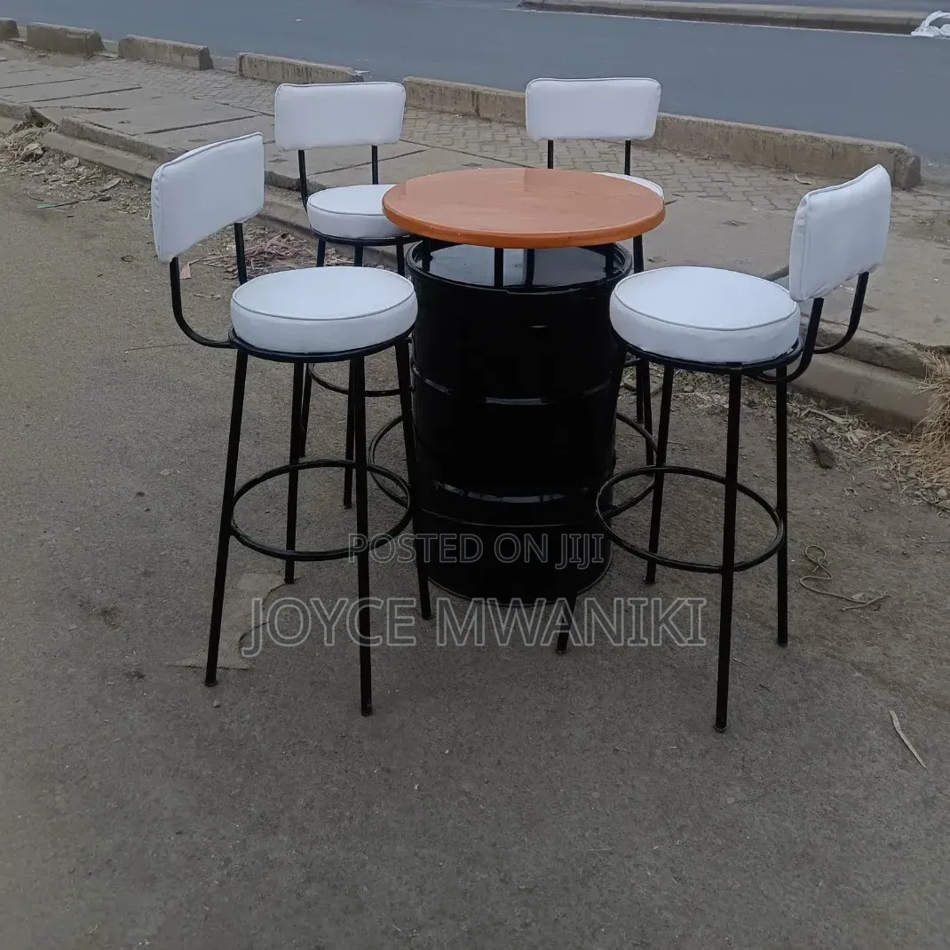 Bar Set of White Chairs and a Custom Drum Table