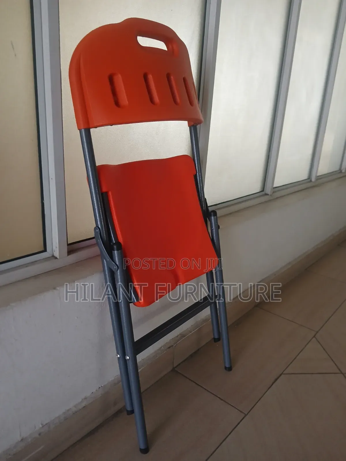 Elevate Plastic Orange Folding Chair