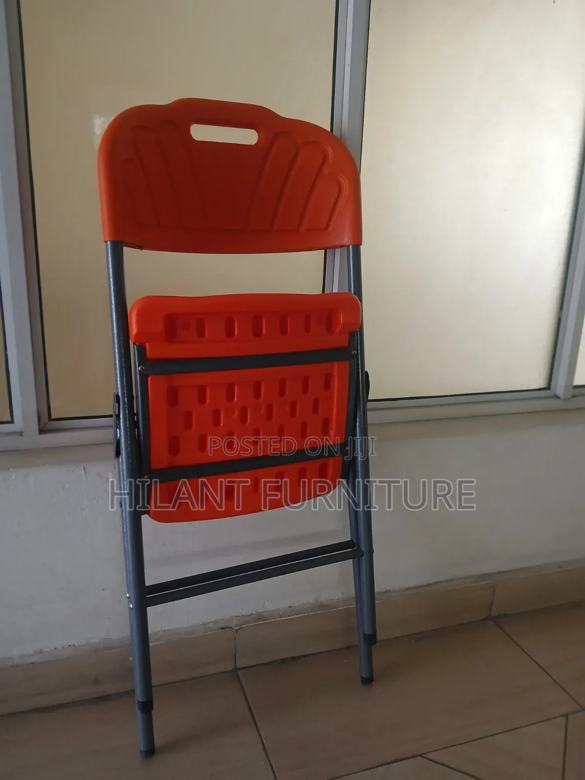 Elevate Plastic Orange Folding Chair