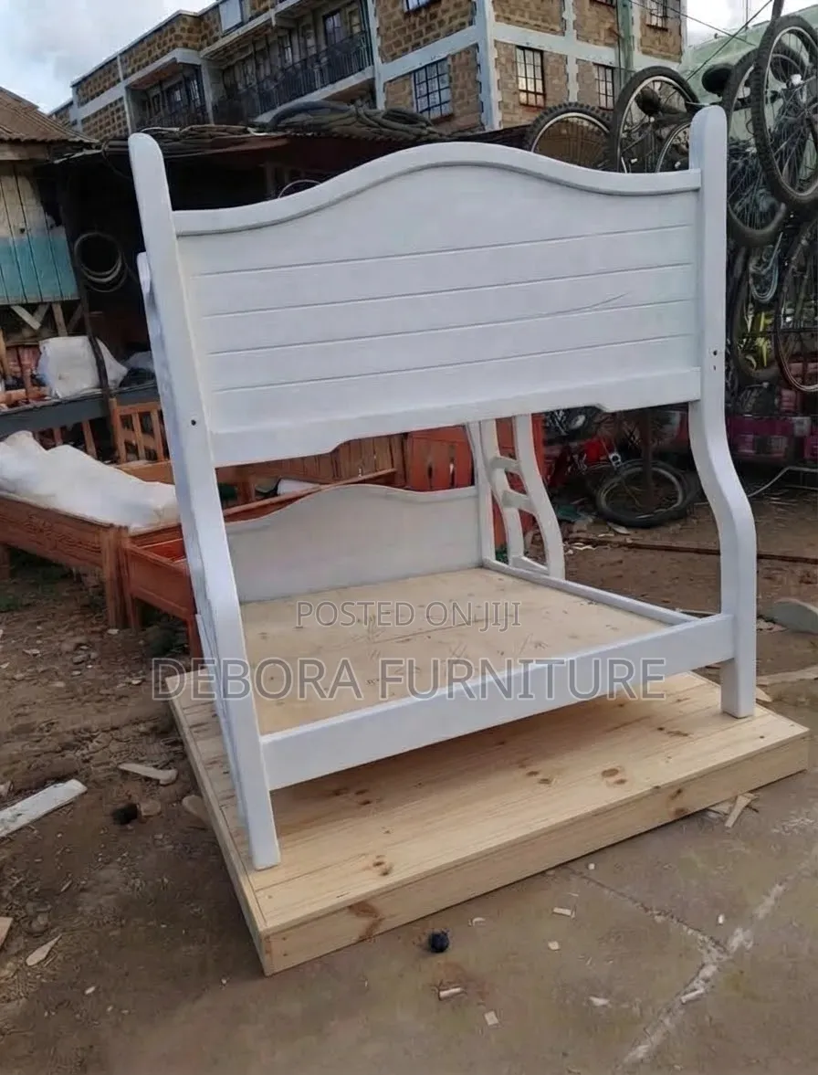 Custom-Built White Wooden Bunk Bed With Integrated Trundle Drawer