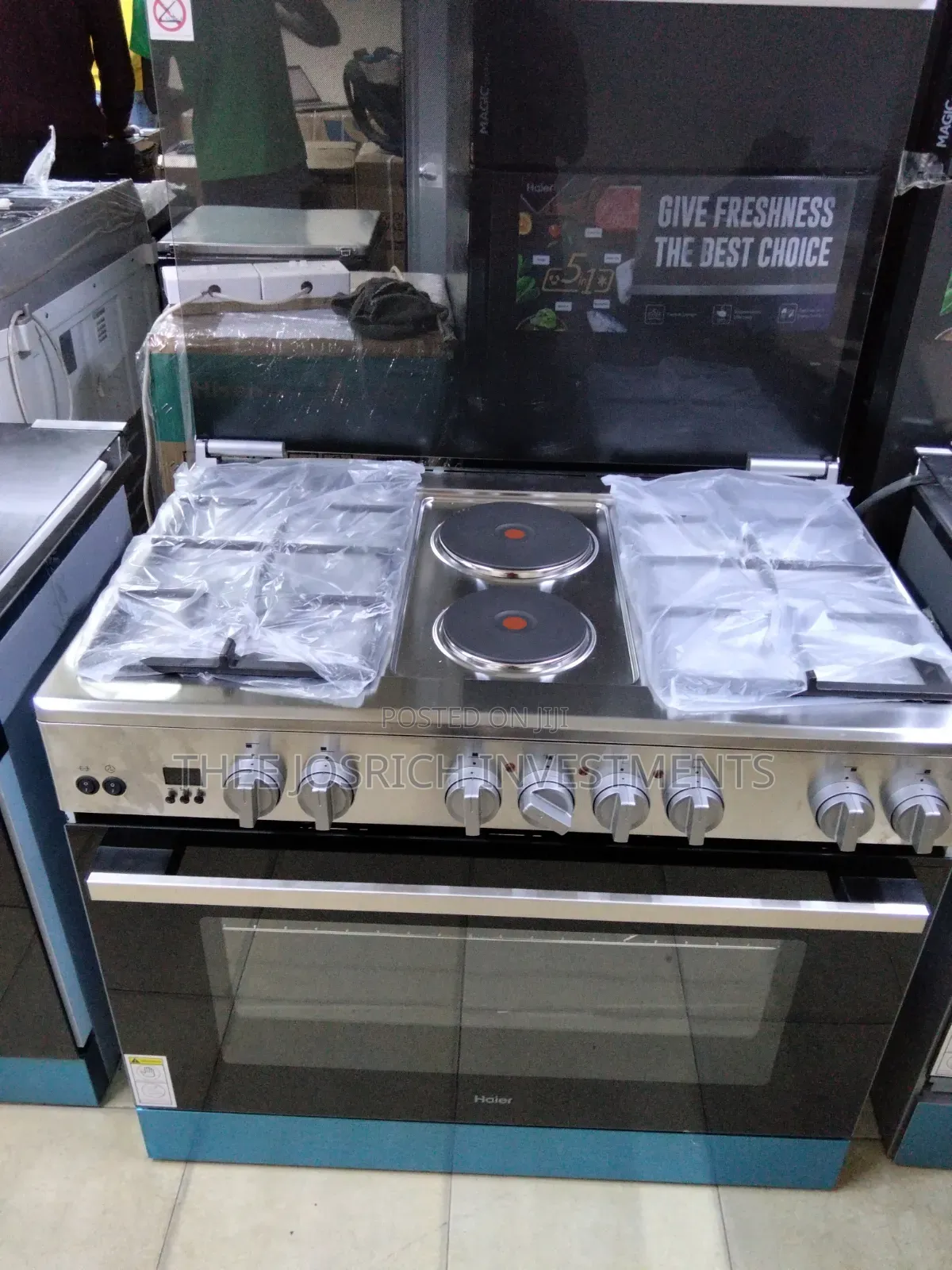Haier 4 Gas + 2 Hot Rapid Plates With Wok Burner Rotisserie Turbo Fan