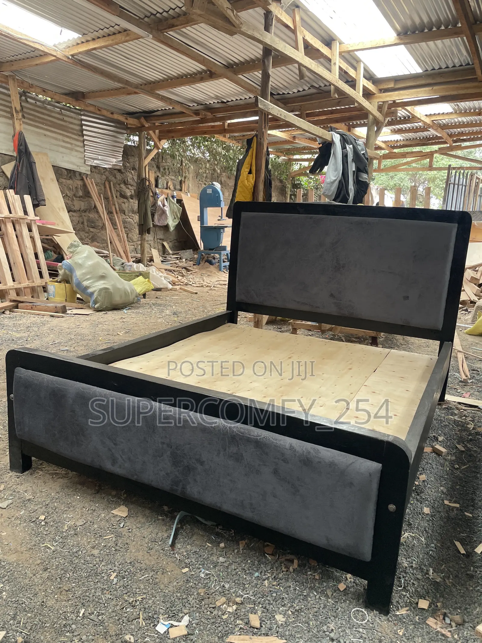 A Dark Grey Fabric, Black Frame Painted Mocket Bed