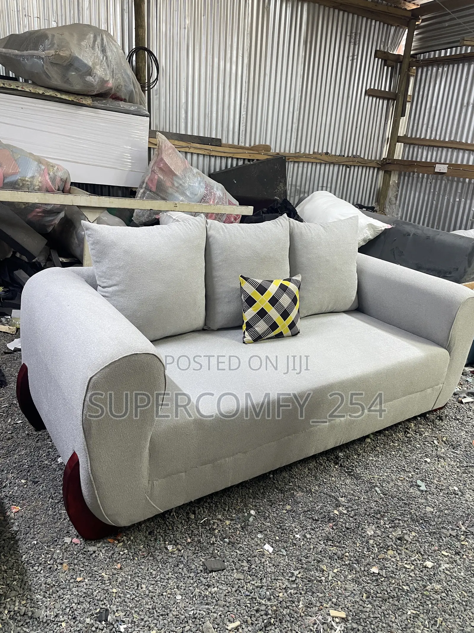 A Three Seater Wooden Stands Boston Seat