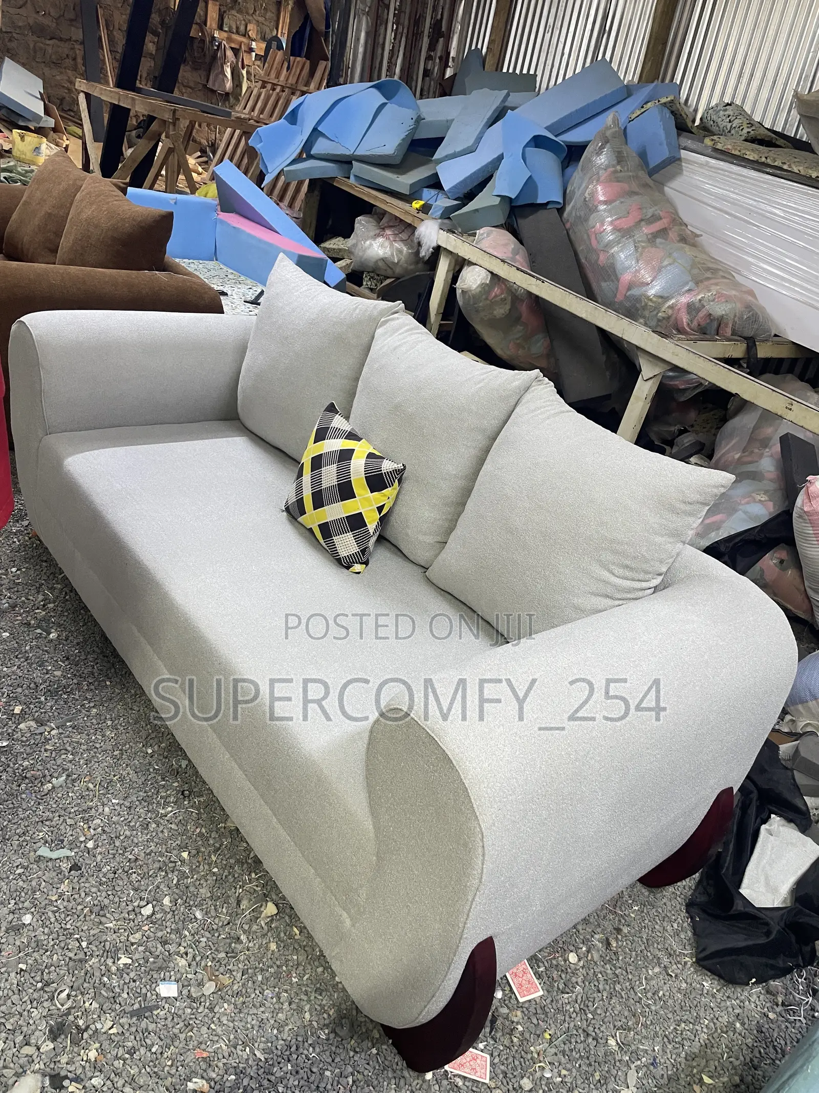 A Three Seater Wooden Stands Boston Seat