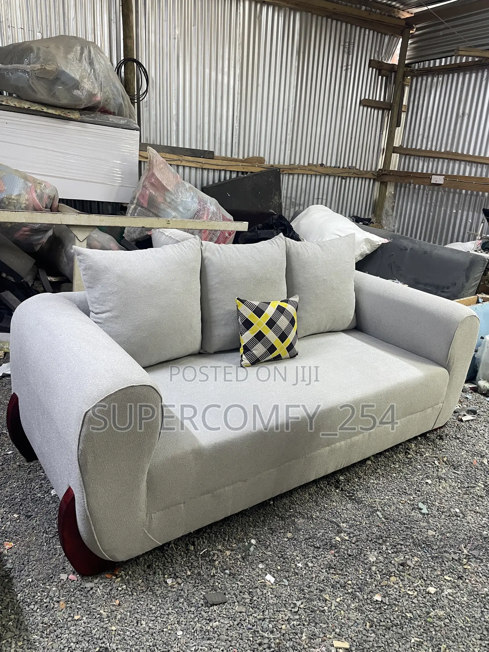 A Three Seater Wooden Stands Boston Seat